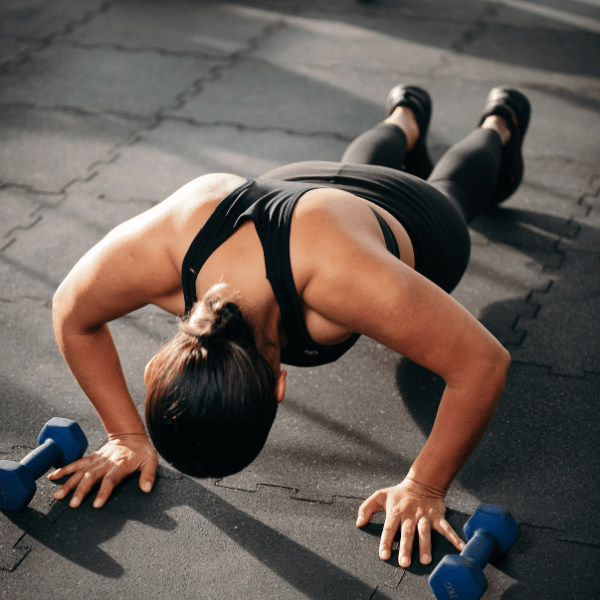 Woman performs a set of crossfit pregnancy workouts